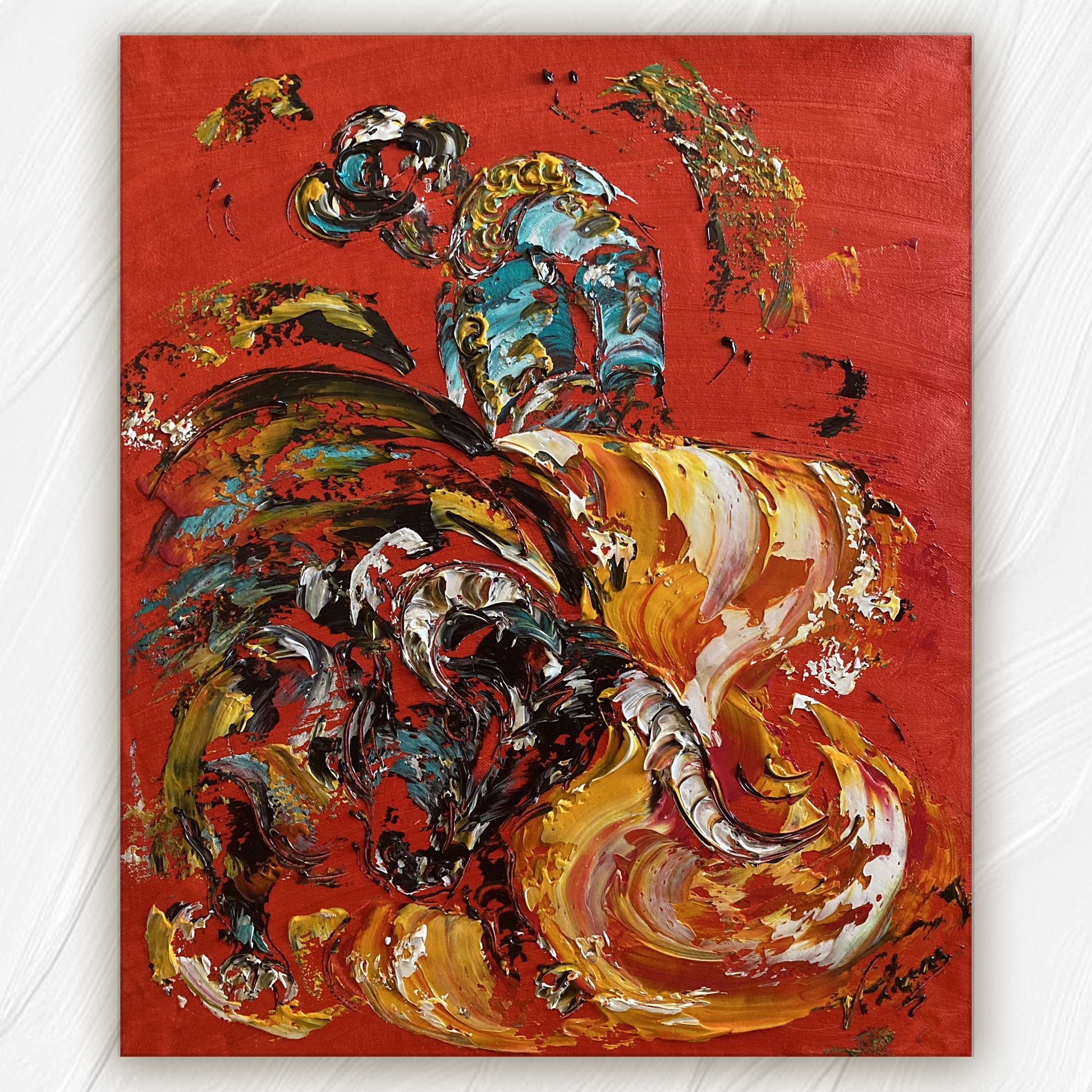 Tableau d'une scène de corrida , le fond est rouge, avec un toréro turquoise et un taureau qui fonce sur la cape  jaune, peinture sur toile de 55x46cm du peintre Virginie Linard ©. 