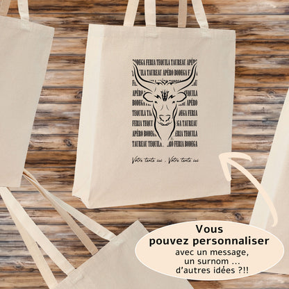 Taureau avec texte Féria, graphisme sur sac tote-bag 21 litres beige, à personnaliser avec un texte. Création Virginie Linard ©.